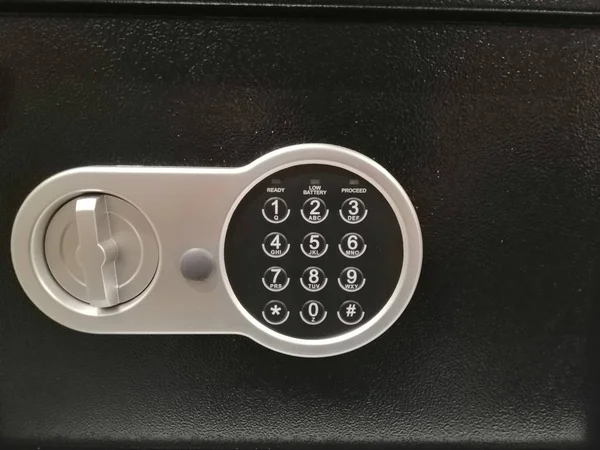 combination lock safe metallic on a black background