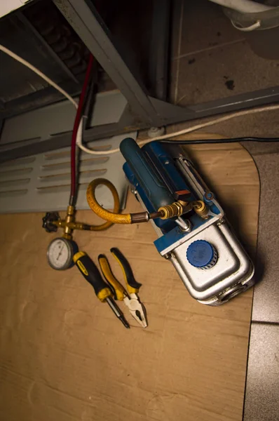 refrigerator repair - equipment and tools of a specialist in work