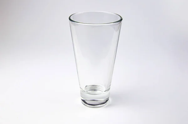 Empty glass transparent glass on a white background.