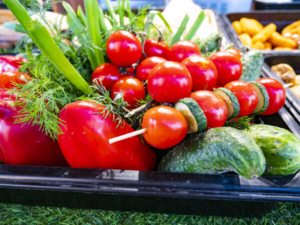 Vegetables on a tray on the counter.