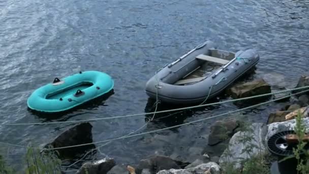 Old inflatable boats near the coastline of north sea — Stock Video