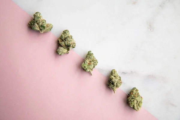 Marijuana Buds Sit Diagonally Pink White Marble Background Minimalist Cannabis — Stock Photo, Image