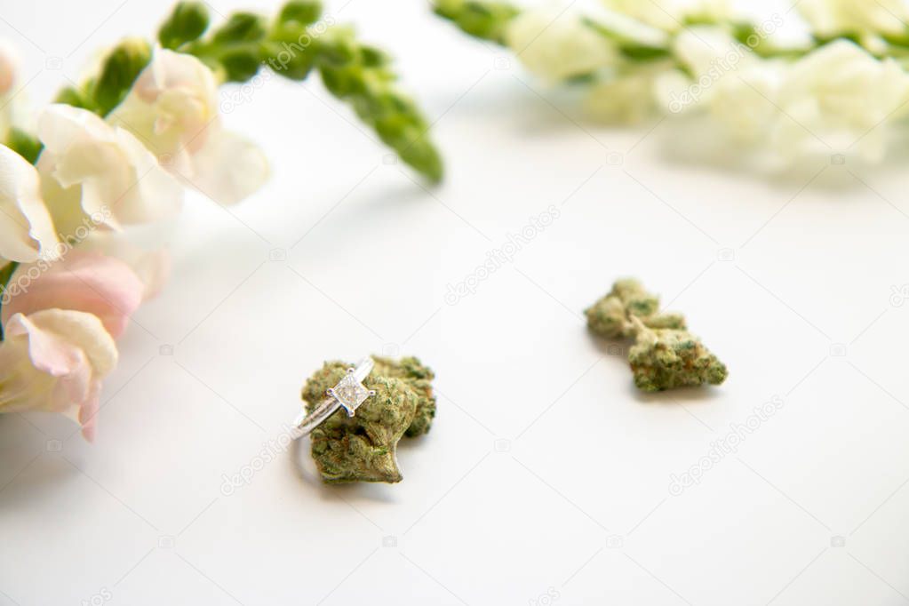 Diamond Engagement Ring on Marijuana Bud White Floral Cannabis Flowers - Cannabis Wedding