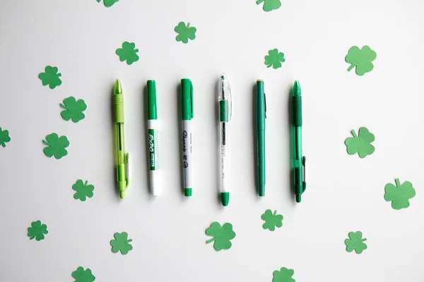 St Patrick's Day Background for Marketing, Business or School Containing Green Pens, Markers and Clovers