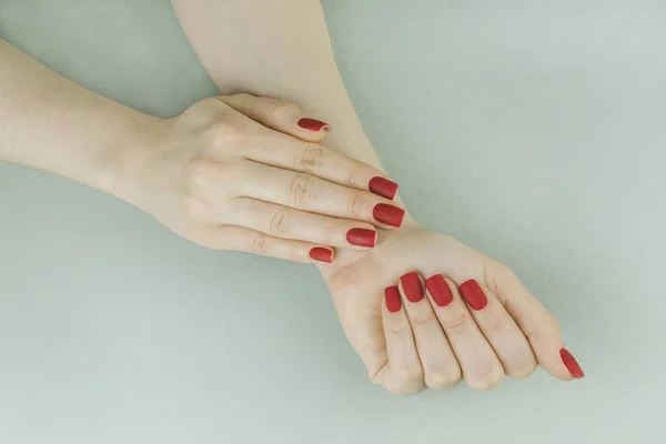 Stylish red matte manicure, square shape — Stock Photo, Image