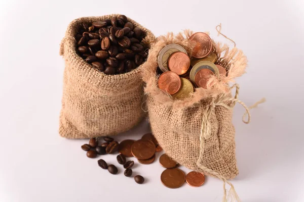 A bag of coffee and a bag of coins