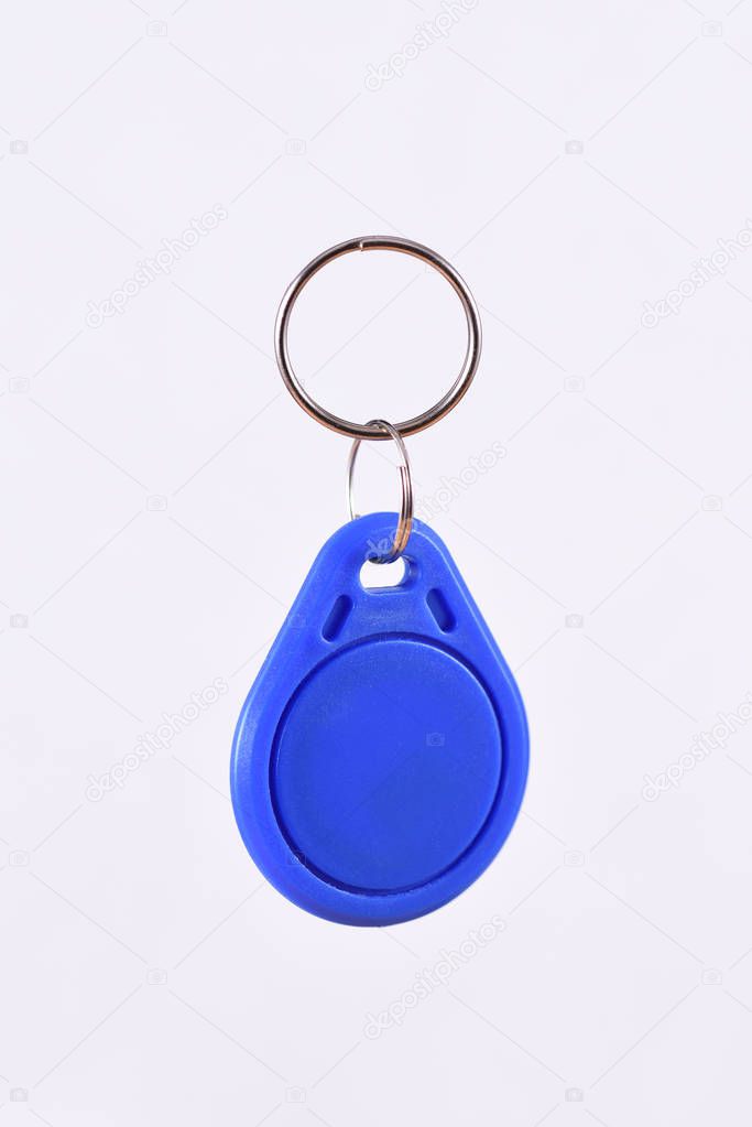 Blue RFID Keychain on the white background, radio-frequency identification
