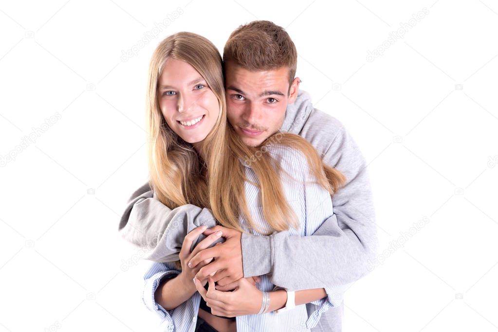 teenage couple posing isolated in white