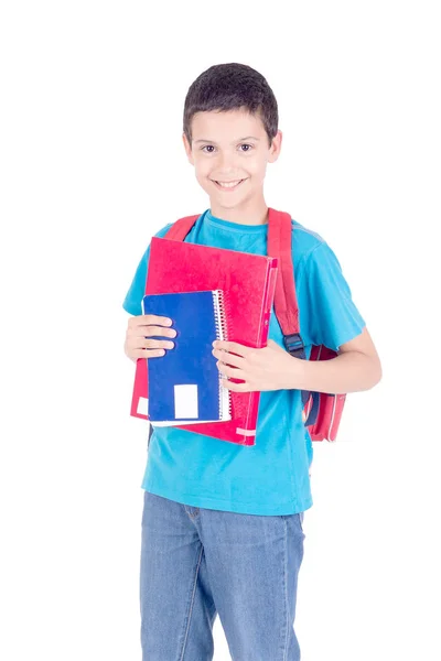白い背景に隔離された教科書とバックパックを持つ小さな男の子 — ストック写真