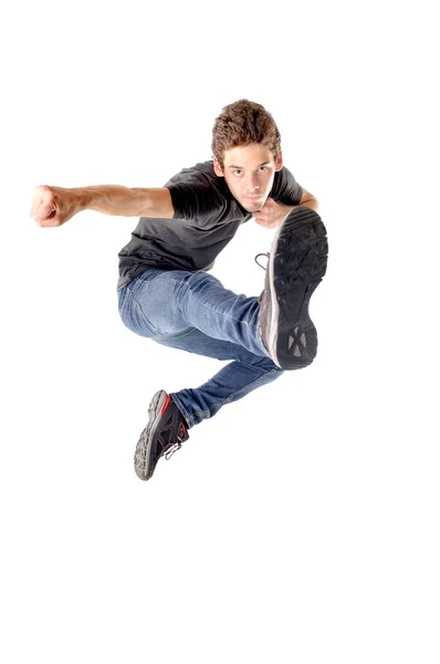 Genç Çocuk Beyazlar Içinde Zıplıyor — Stok fotoğraf