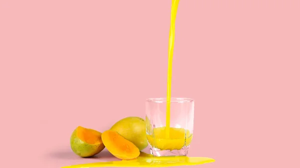 mango juice with, isolated on a pink background