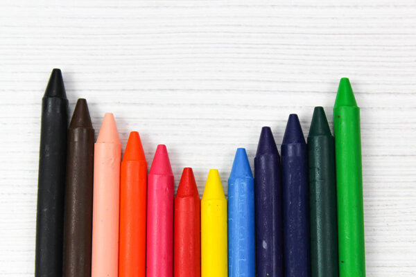 Many colourful crayon, isolated on a white surface, School Supplies