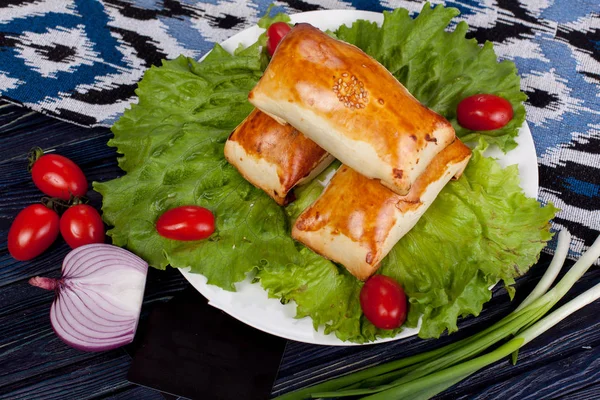 Chebureks. Traditional meat dish of the peoples of Central and Central Asia, rice, meat and onions, suitable for the Nauryz or Navruz holidays, as well as during the Holy month of Ramadan and the holidays of Uraz Ait and Kurban Bayran. for use in hol