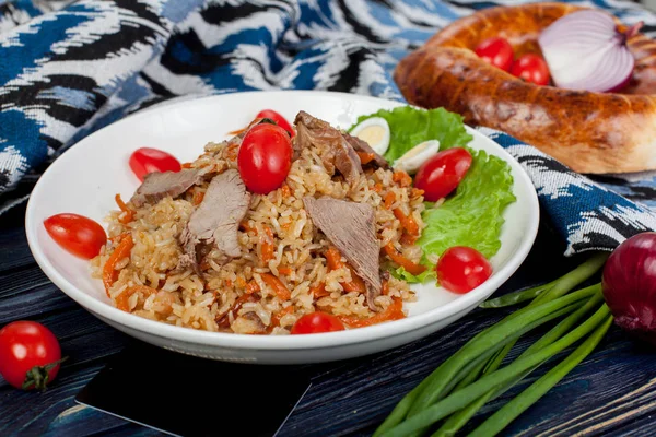 Pilaf. Meat dish of the peoples of Central and Central Asia, rice, meat and onions, suitable for the Nauryz or Navruz holidays, as well as during the Holy month of Ramadan and the holidays of Uraz Ait and Kurban Bayran. for use in holiday design.