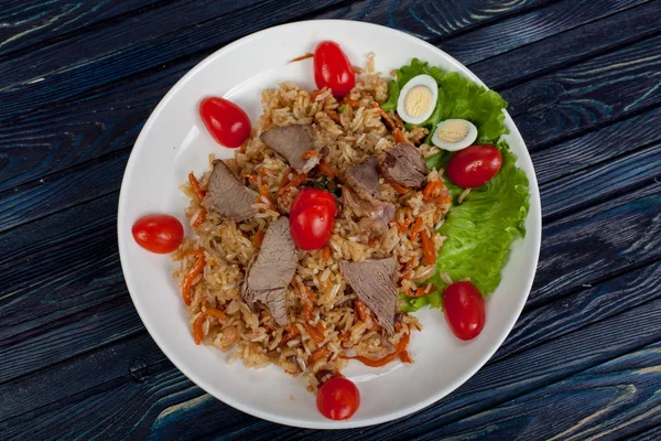 Pilaf. Meat dish of the peoples of Central and Central Asia, rice, meat and onions, suitable for the Nauryz or Navruz holidays, as well as during the Holy month of Ramadan and the holidays of Uraz Ait and Kurban Bayran. for use in holiday design.