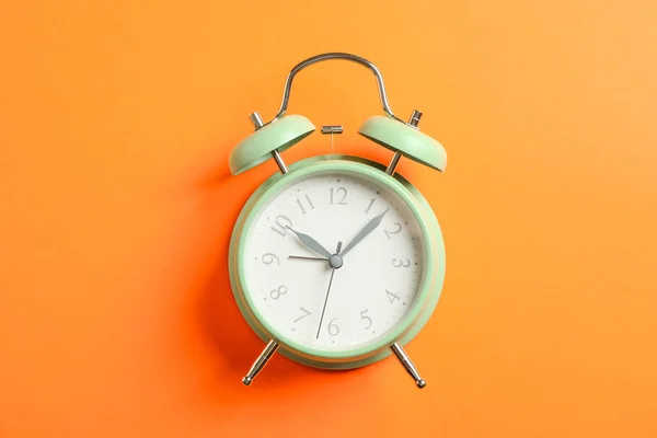 Retro alarm clock on color background, space for text — Stock Photo, Image