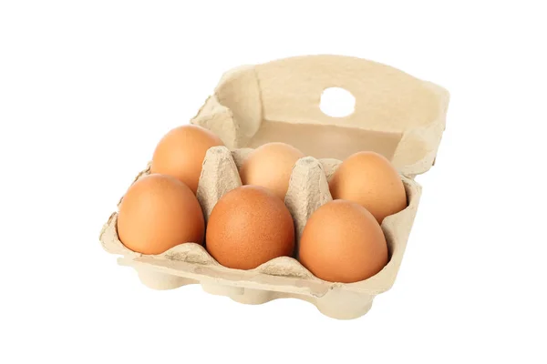 Kilka surowe jaja kurze w pudełku na białym tle — Zdjęcie stockowe