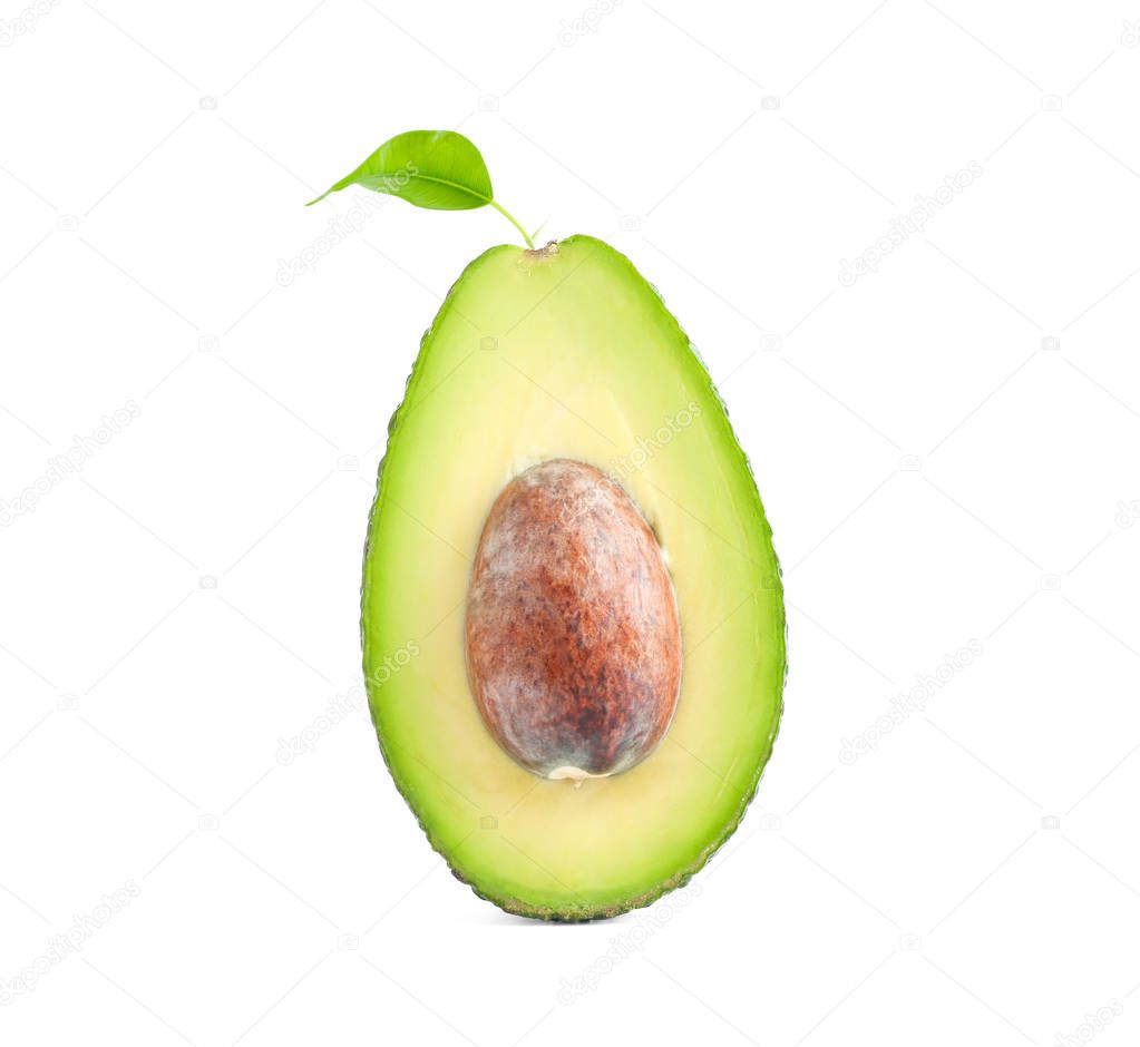 Ripe cut avocado with leaf isolated on white background. Healthy