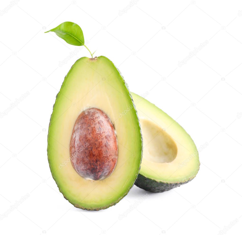 Ripe cut avocado with leaf isolated on white background. Healthy