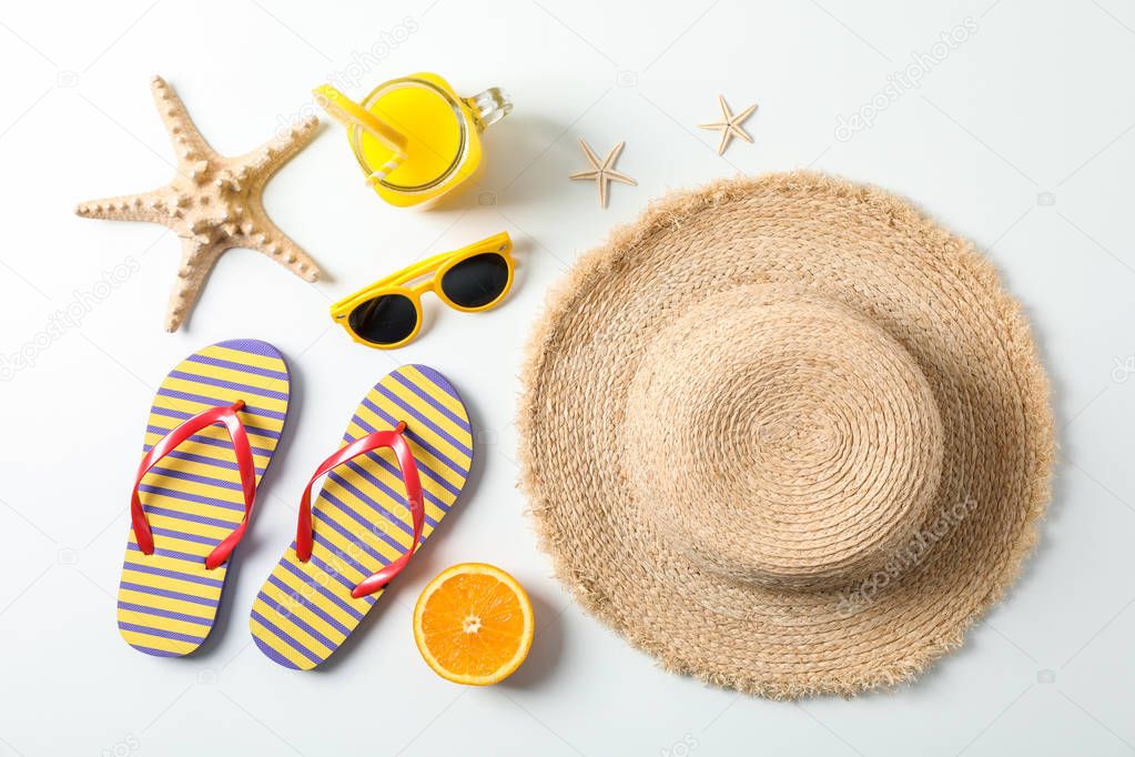 Flat lay composition with summer vacation accessories on white b