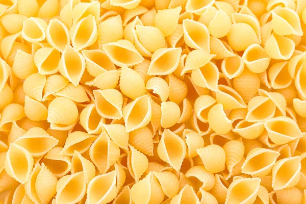 Pasta como fondo, primer plano. Pastas integrales sin cocer —  Fotos de Stock