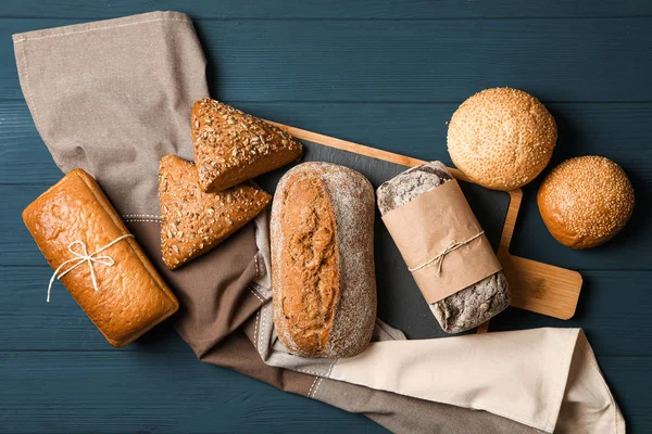 Flat lay composition with bakery products on wooden background,