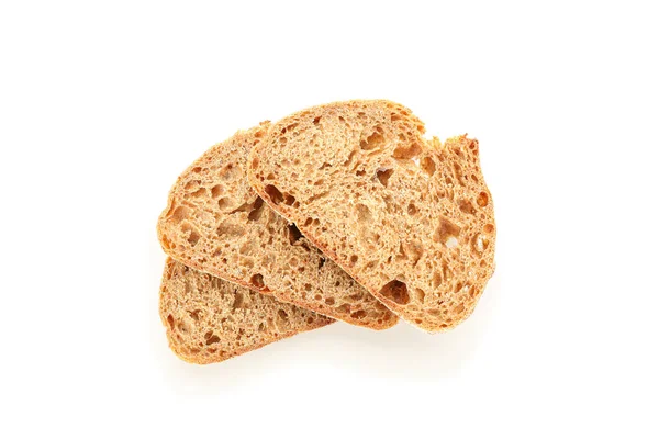 Kousky pšeničného chleba izolované na bílém pozadí. Pekařské výrobky — Stock fotografie