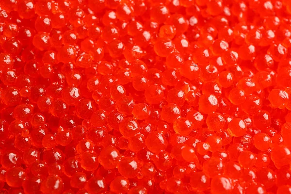 Delicioso caviar rojo como fondo, de cerca —  Fotos de Stock