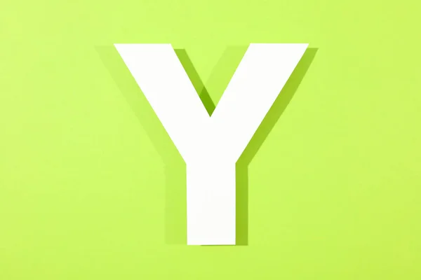 色の背景に白い文字 Y、テキスト用のスペース — ストック写真
