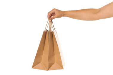 Kadın el beyaz arka plan üzerinde izole kağıt torbatutun