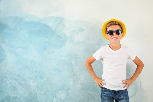 Boy with sunglasses and hat against color background, space for — Stock Photo, Image