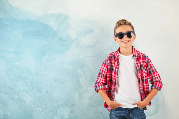 Steep boy with sunglasses against color background, space for te — Stock Photo, Image