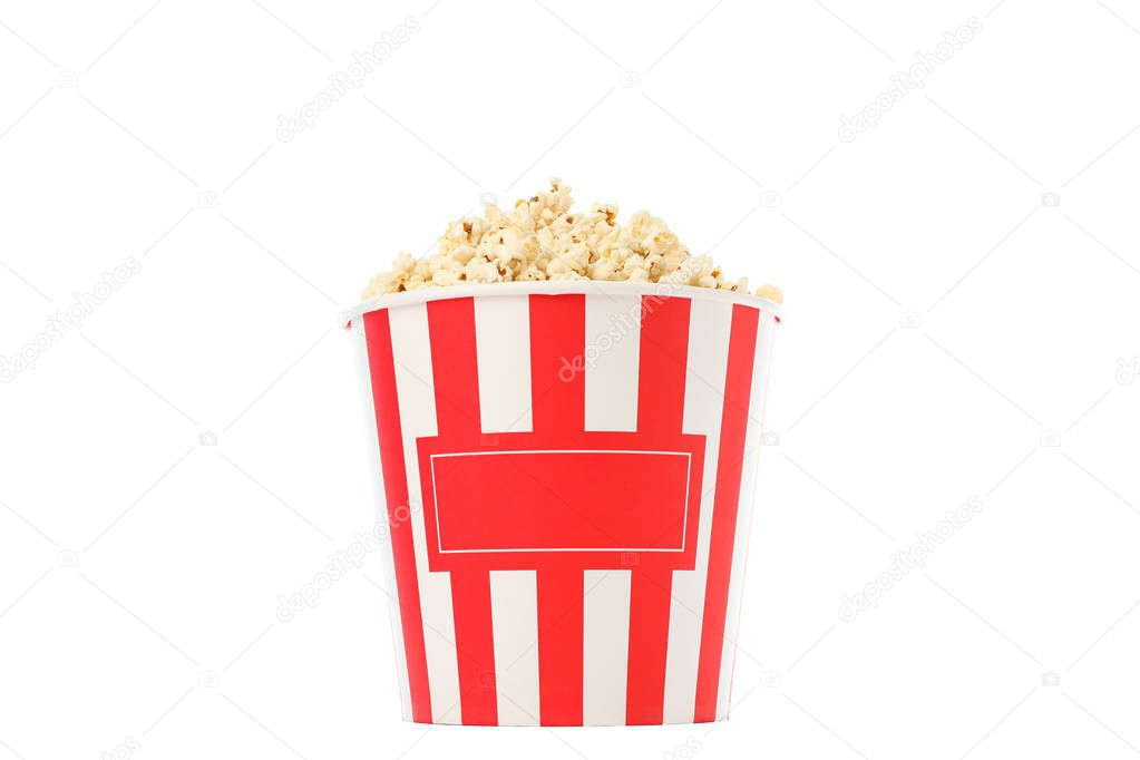 Striped bucket with popcorn isolated on white background