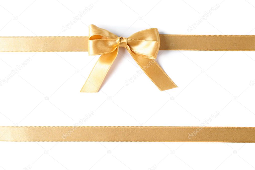 Golden ribbons with bow isolated on white background. Gift conce