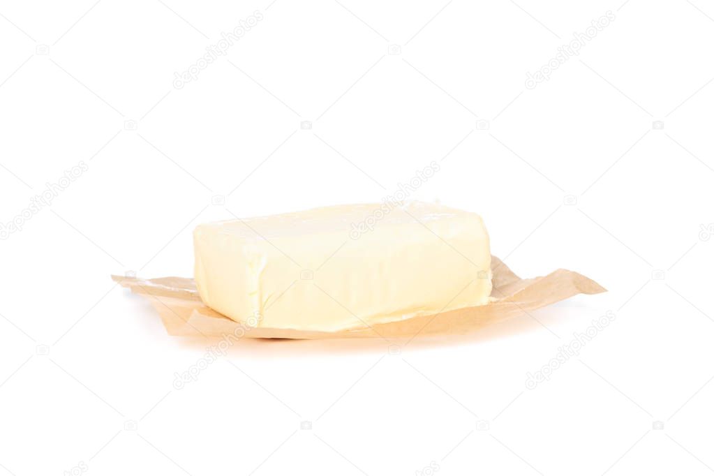 Butter on baking paper isolated on white background