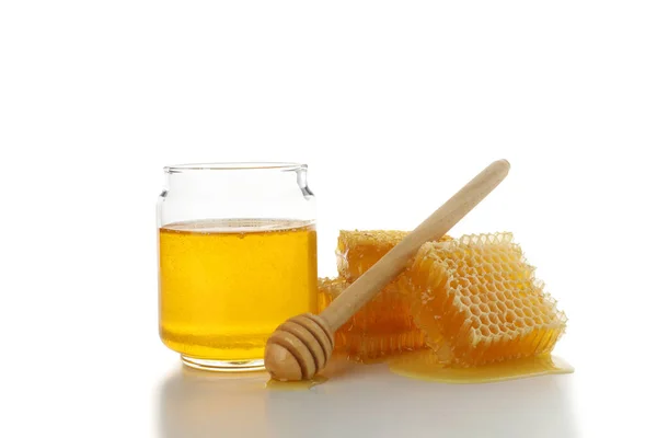 Pieces of honeycomb, glass jar and dipper isolated on white back — Stock Photo, Image