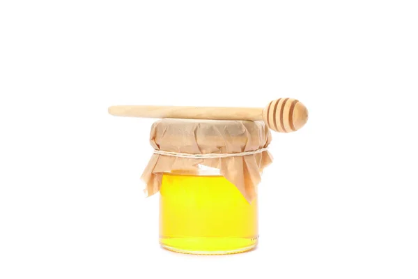 Mergulhador e frasco de vidro com mel isolado no fundo branco — Fotografia de Stock