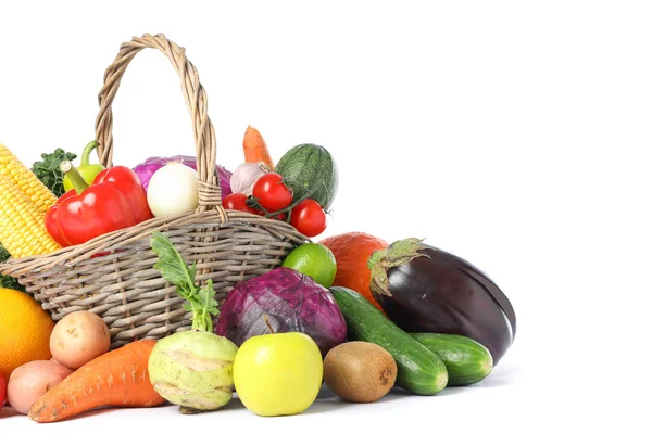 Wicker basket and different vegetables isolated on white backgro — Stock Photo, Image