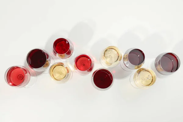 Flat lay composition. Glasses with different wine on white backg — Stock Photo, Image