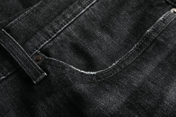 Zwarte jeans getextureerde achtergrond, close-up — Stockfoto