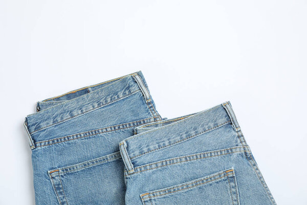 Jeans on white background, space for text