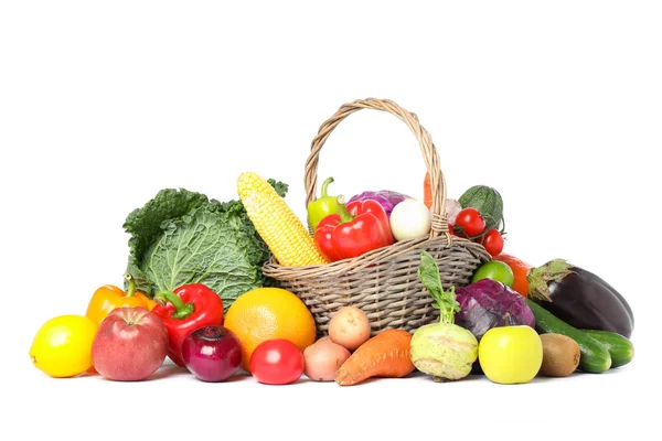 Wicker basket and different vegetables isolated on white backgro — Stock Photo, Image