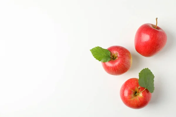 Flat lay with red apples on white background, space for text — Stock Photo, Image