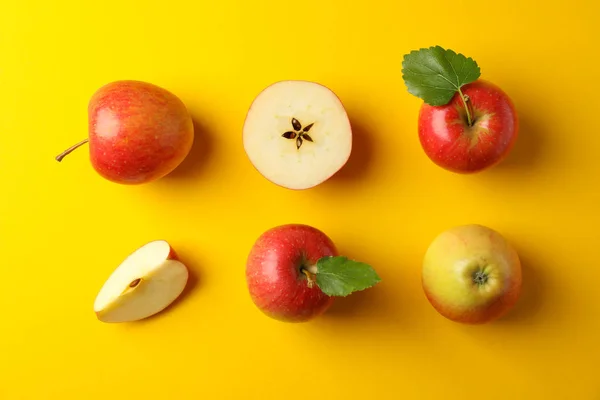 Flat lay with red apples on yellow background, space for text — Stock Photo, Image