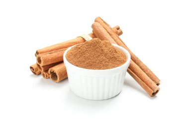 Cinnamon sticks and powder isolated on white background. Sweet s