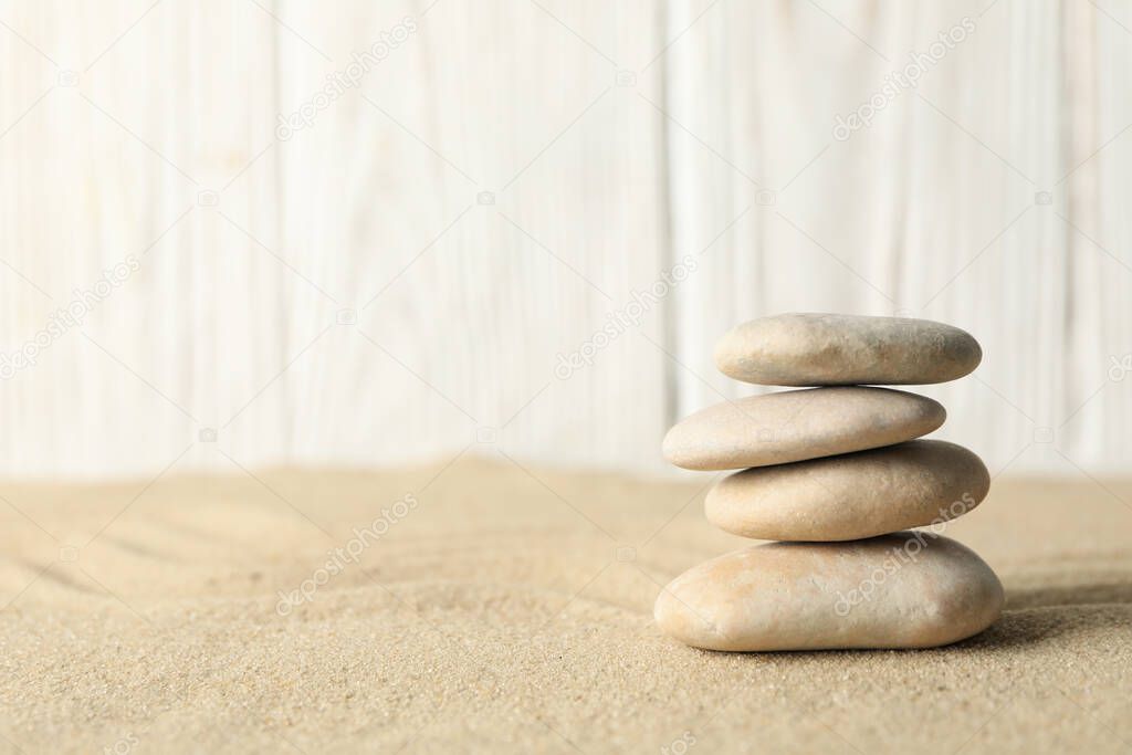 Stones on the sand background. Zen concept