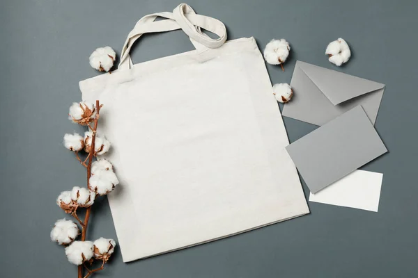 Cotton, bag and envelope on light black background, space for text