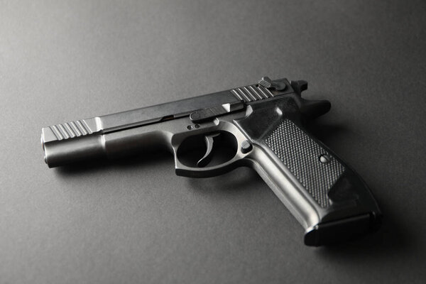 Pistol on black background. Self defense weapon