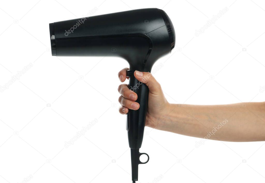 Female hand holds hair dryer, isolated on white background