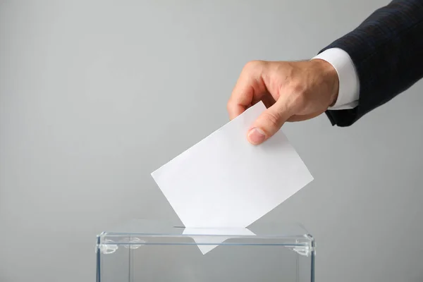 Man Putting Ballot Voting Box Gray Background — Stock Photo, Image